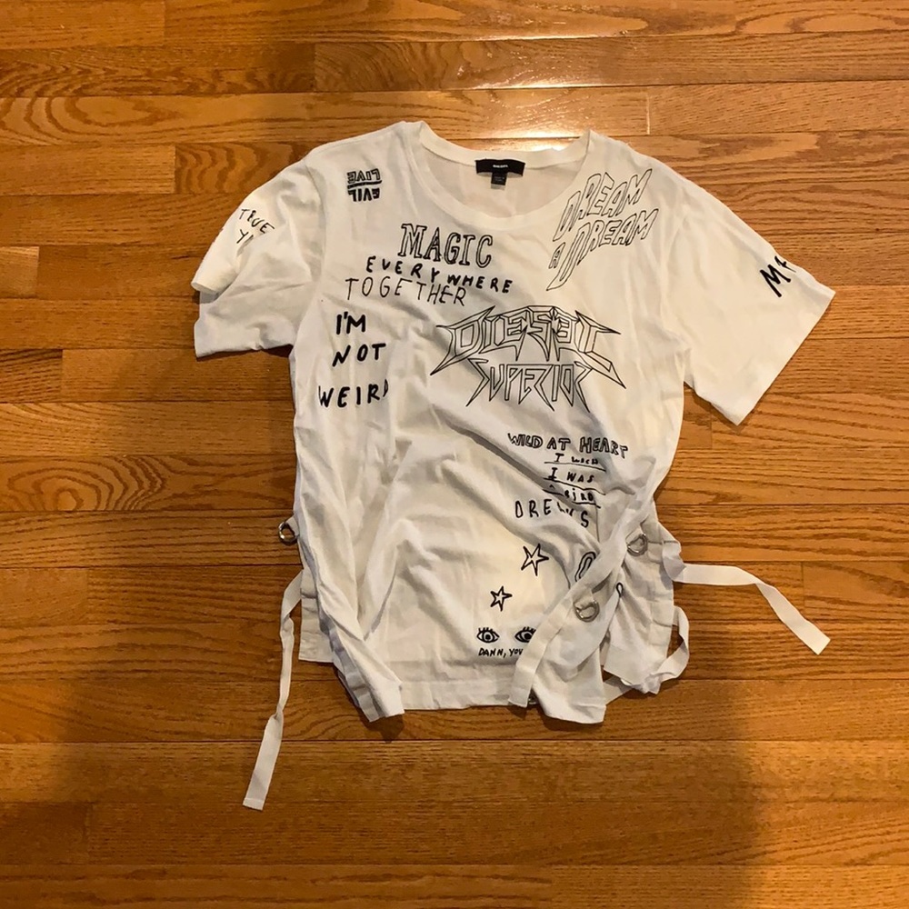 White graphic tee with tees on the side